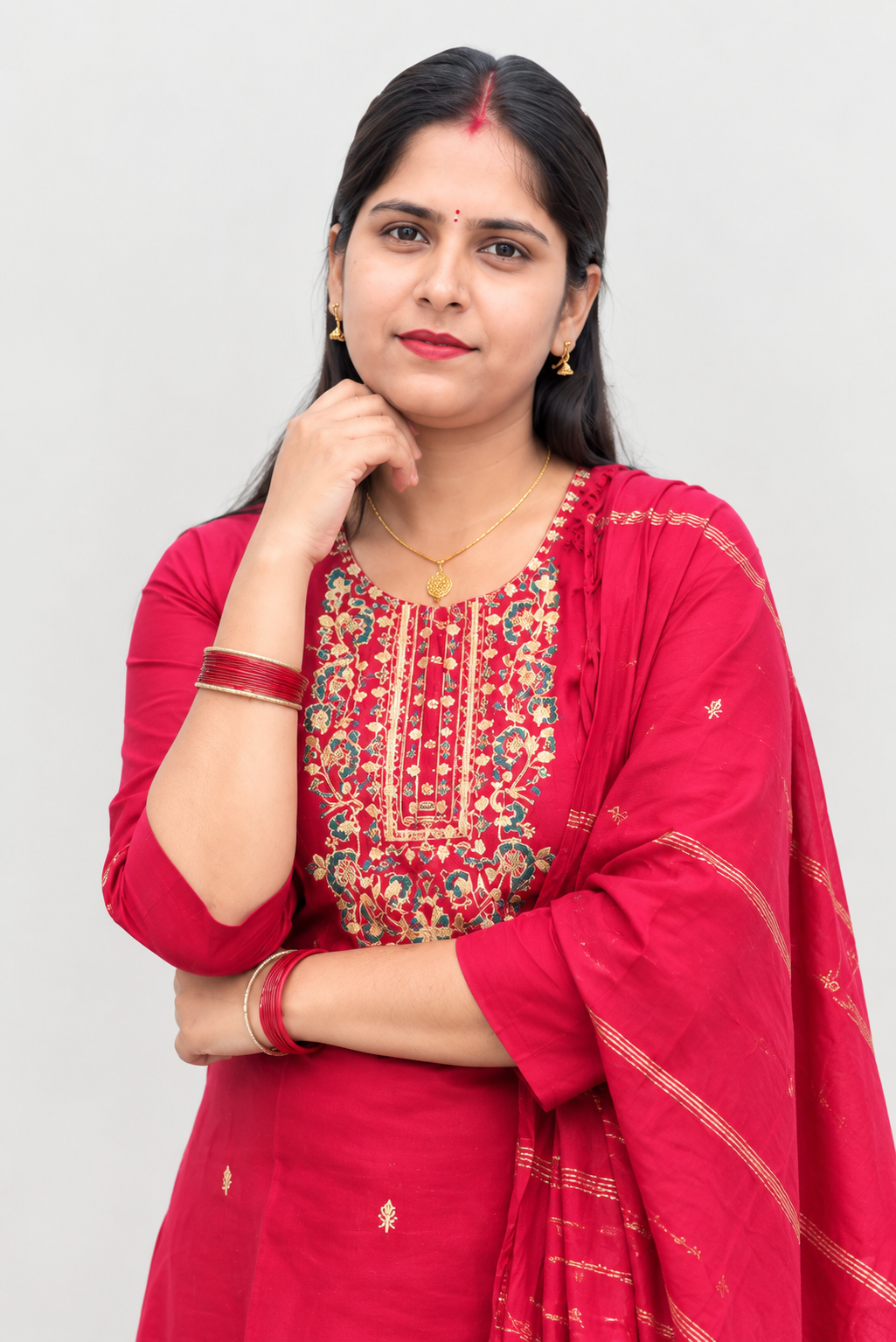 red embroidered kurta set paired with a matching dupatta and traditional red bangles.