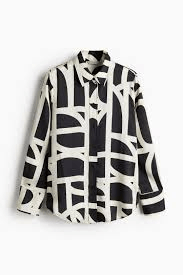 Monochrome abstract print blouse is designed for a boldy